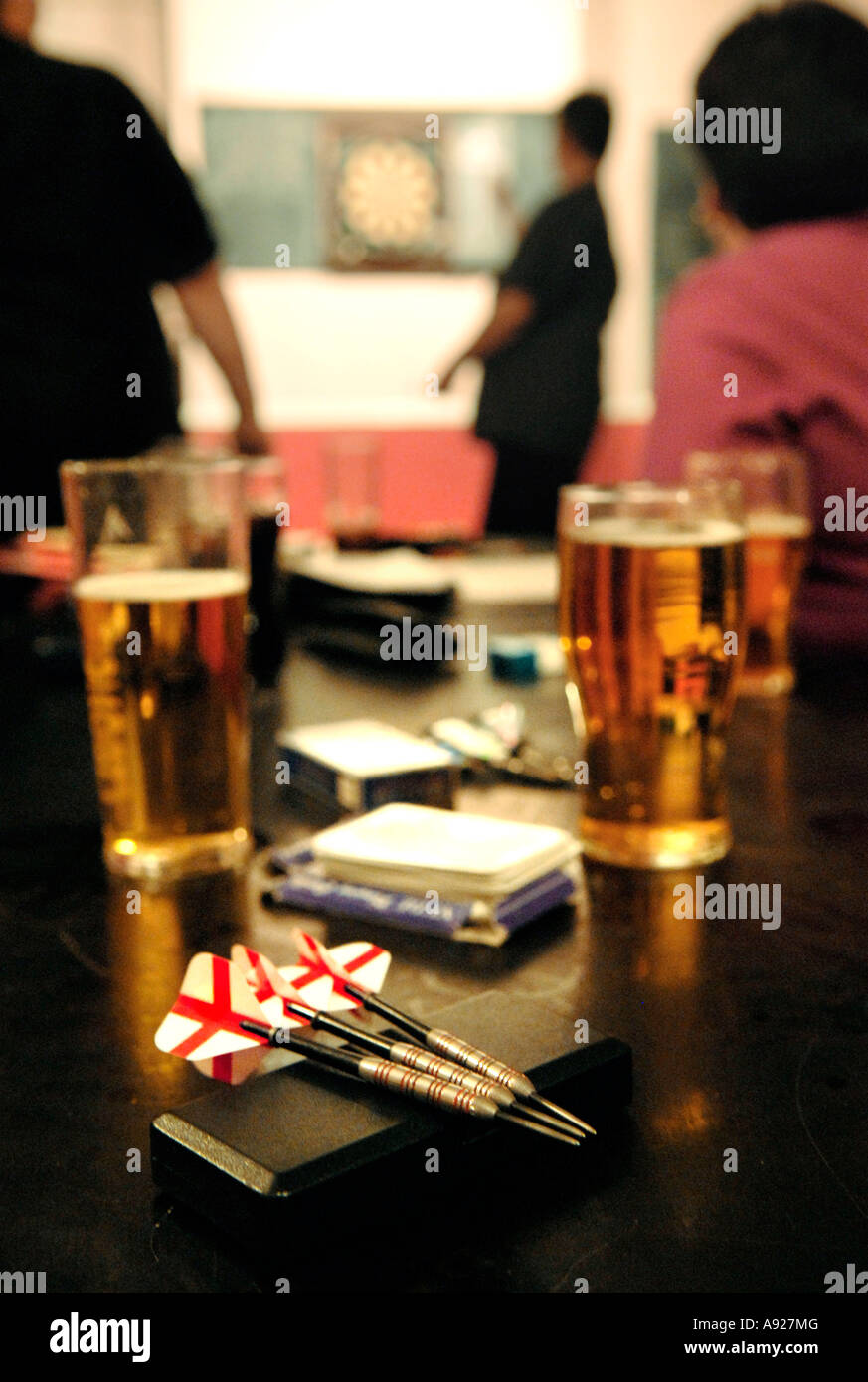 Women play darts in a pub in East London, England Stock Photo Alamy
