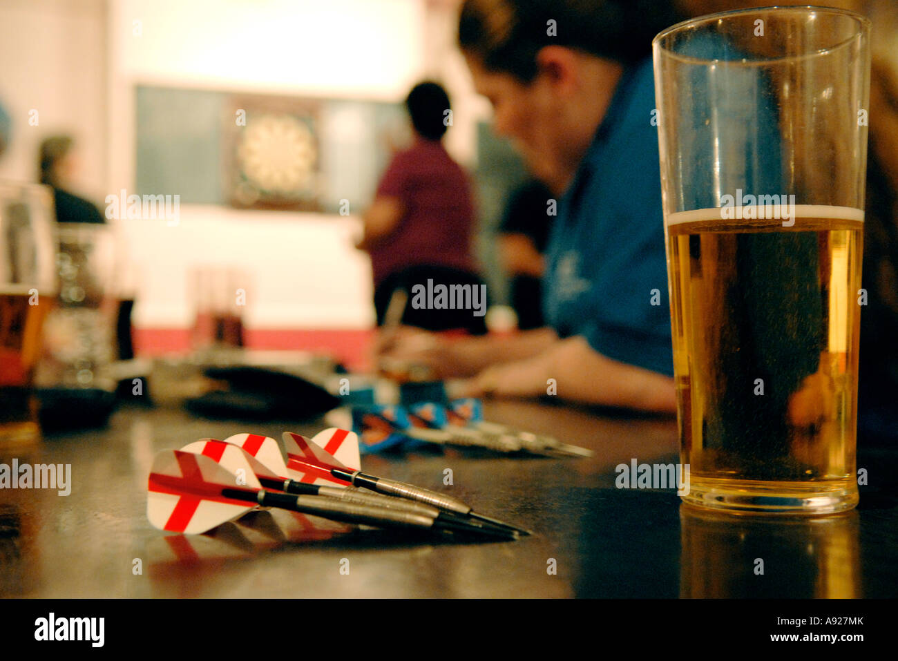Women play darts in a pub in East London, England Stock Photo Alamy