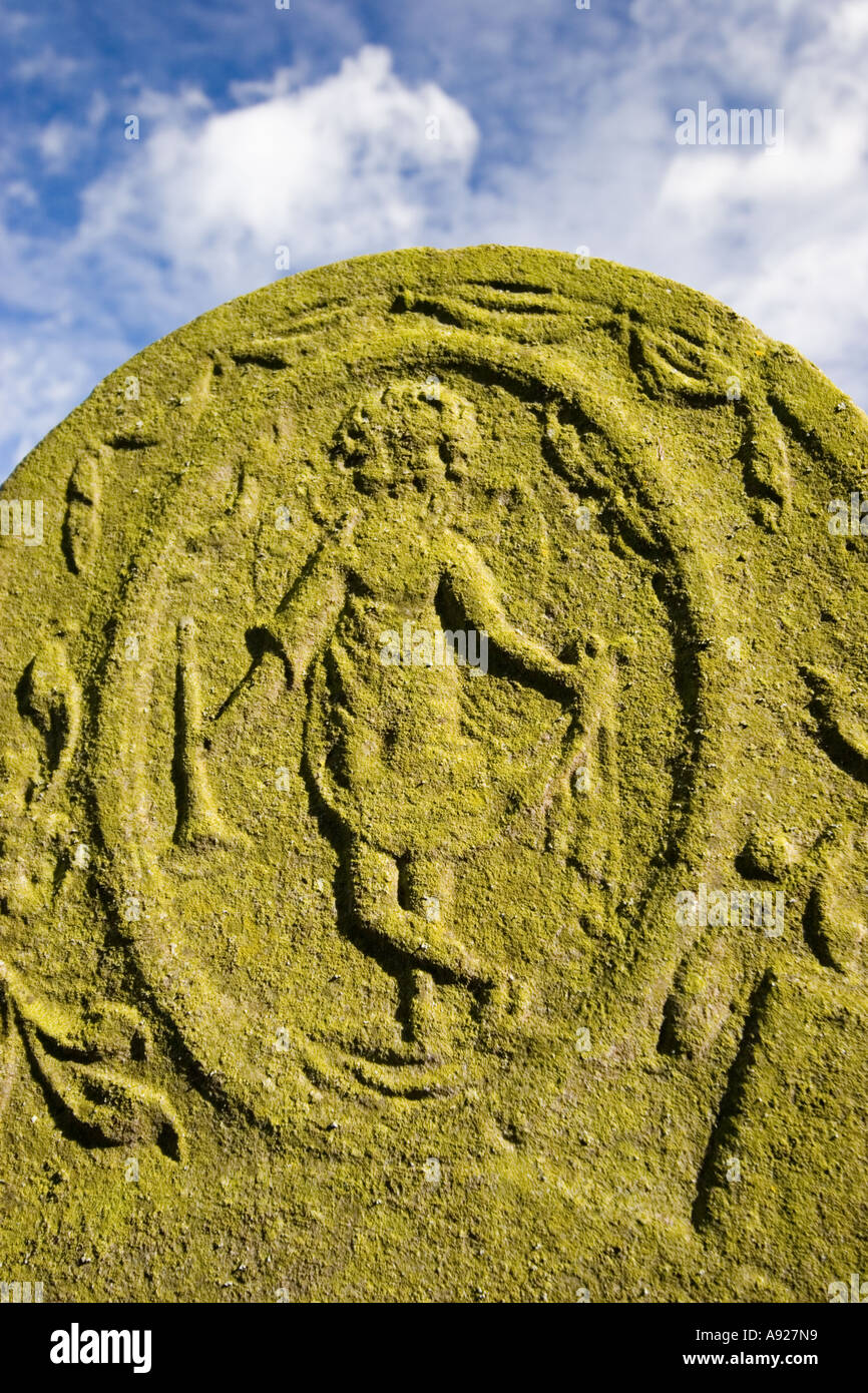 Carving on churchyard gravestone Stock Photo