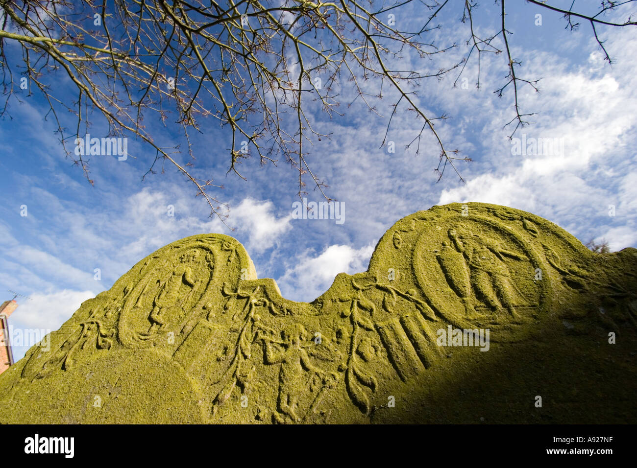 Carving on churchyard gravestone Stock Photo