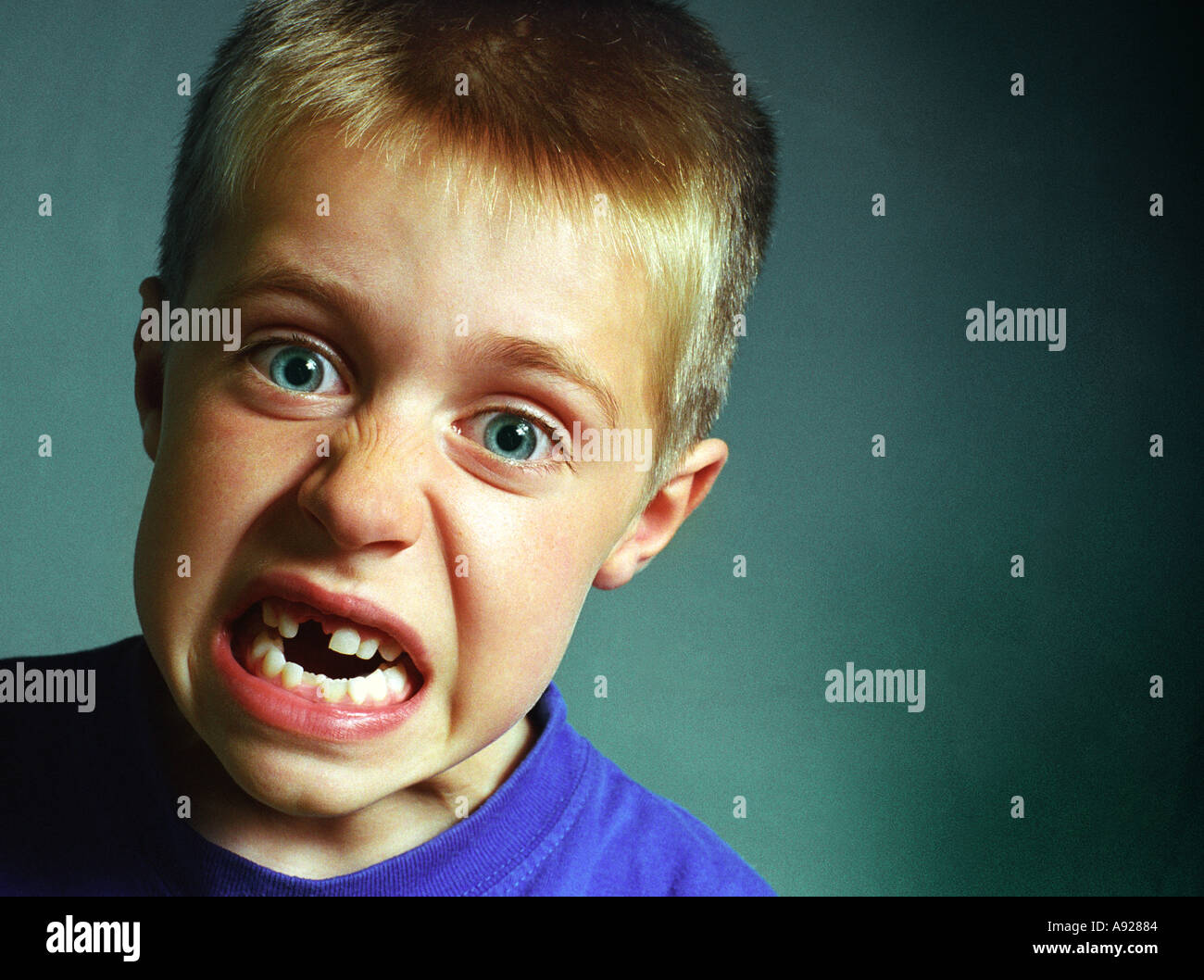 SEVEN YEAR OLD BOY LOSES FRONT TOOTH PULLS FACE Stock Photo Alamy