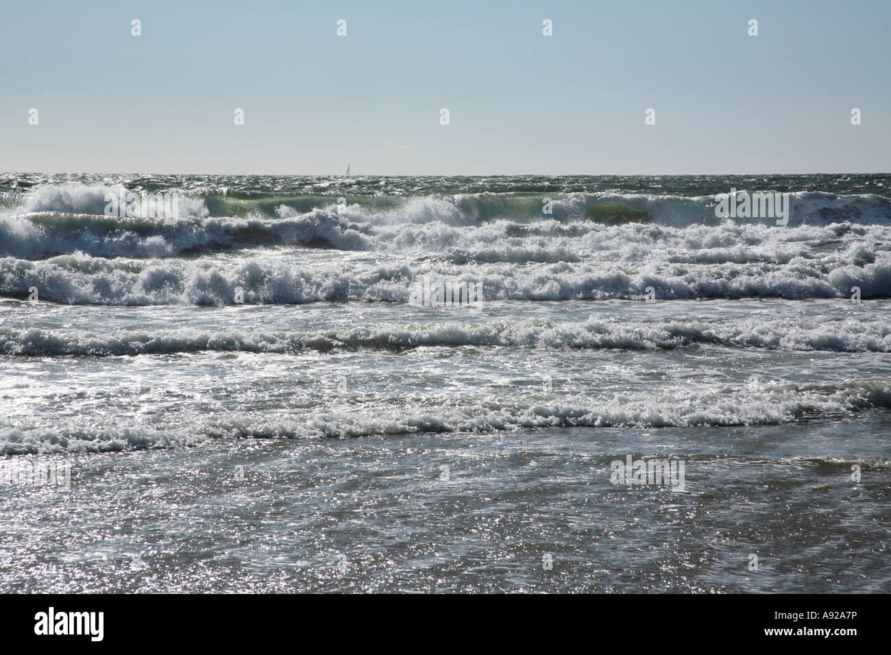 Surf waves roll in hi-res stock photography and images - Alamy