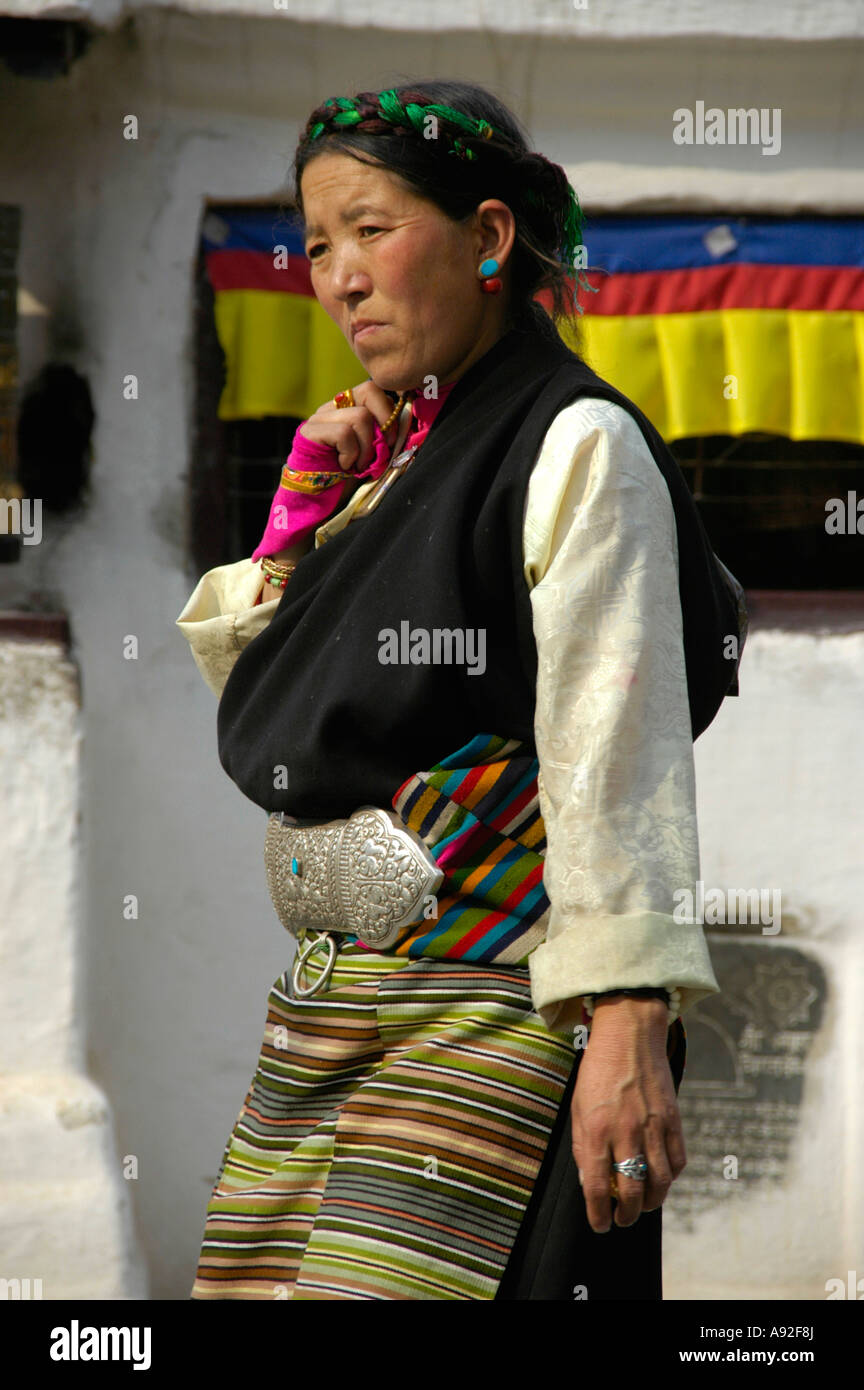 Tibetan woman in traditional dress Bodhnath Stupa Kathmandu Nepal Stock Photo