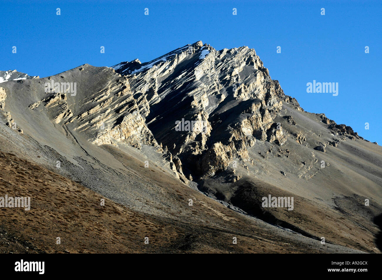 Tilted rocks of a mountain peak Nar Nar-Phu Annapurna Region Nepal Stock Photo