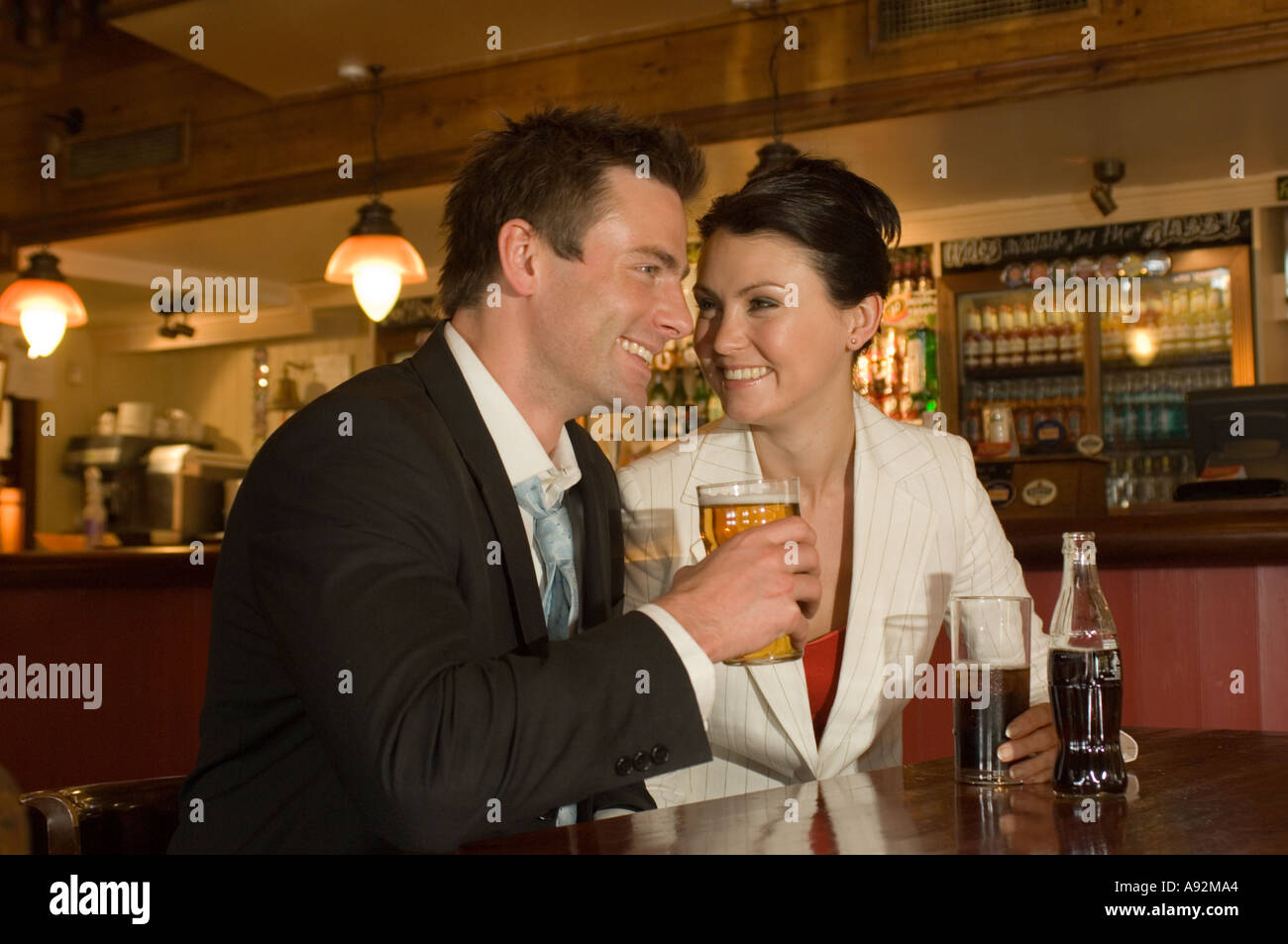 couple having a drink in a bar and chatting Stock Photo Alamy