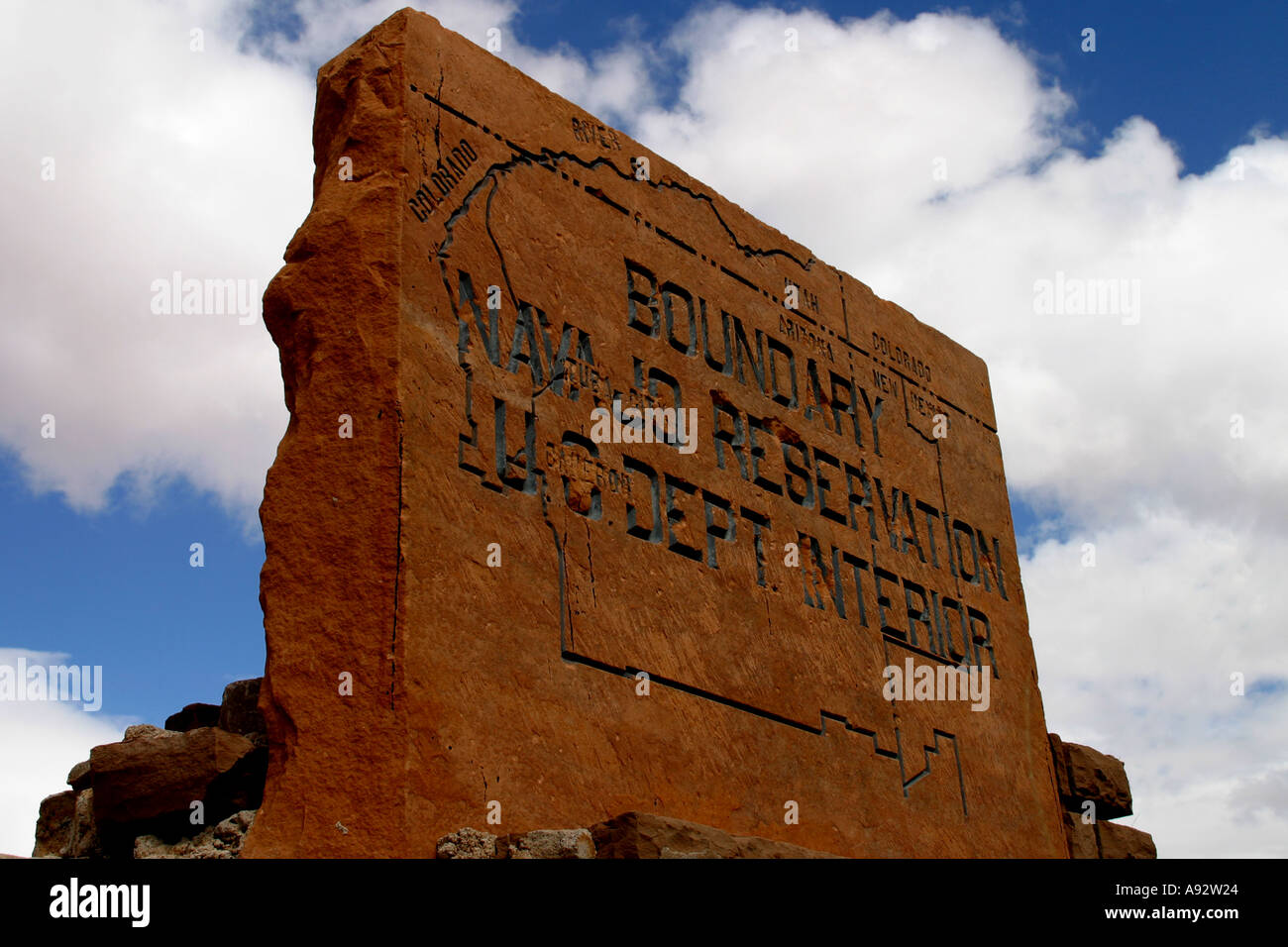 A big stone sign signifying the border of the Navajo native American reservation Stock Photo Alamy