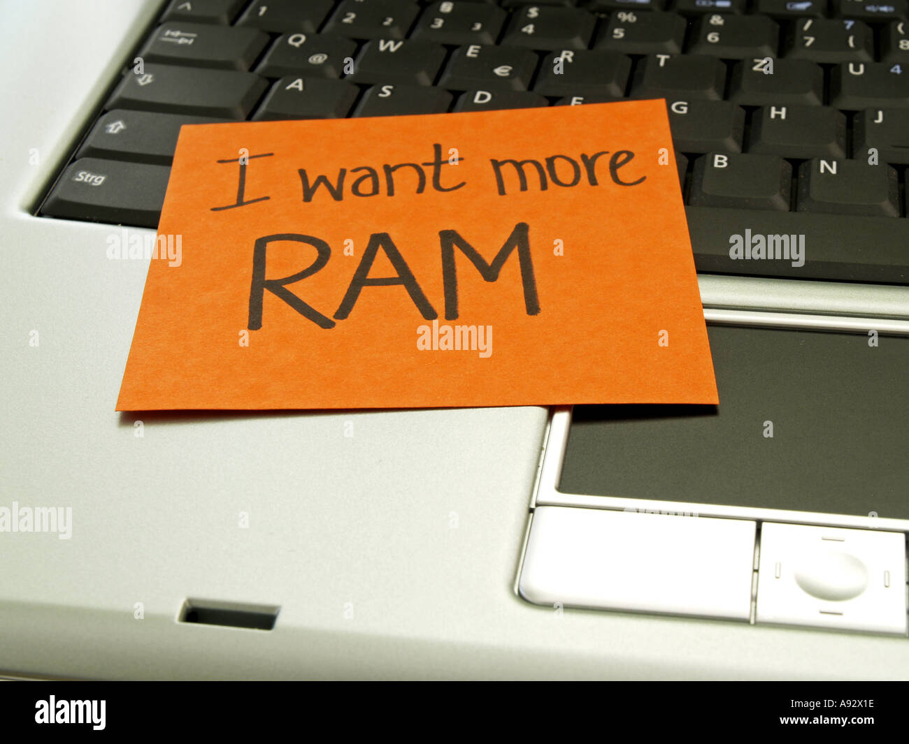 memo note on notebook I want more RAM Stock Photo