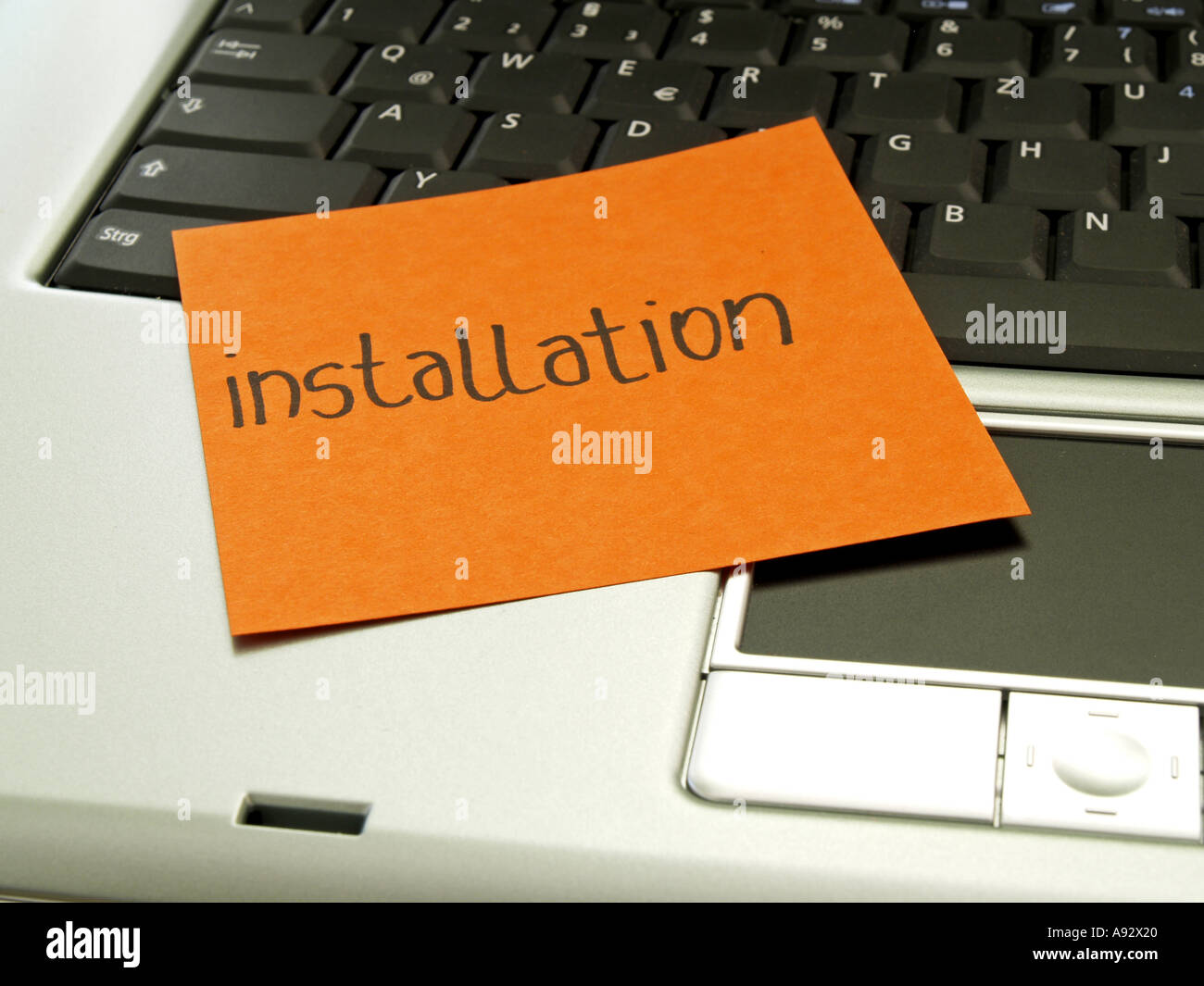 memo note on notebook, installation Stock Photo