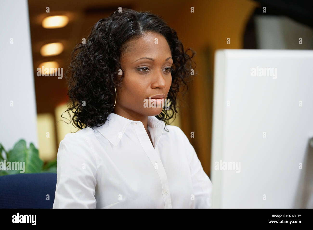 African businesswoman working at desk Stock Photo - Alamy