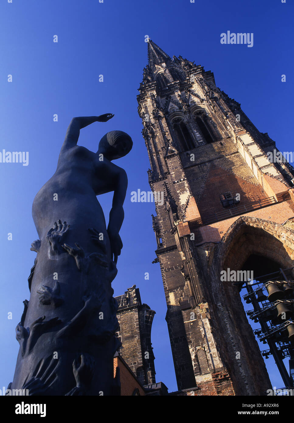 Nikolaikirche church spire and Edith Breckwoldt's Earth Angel sculpture Hamburg Germany Stock Photo