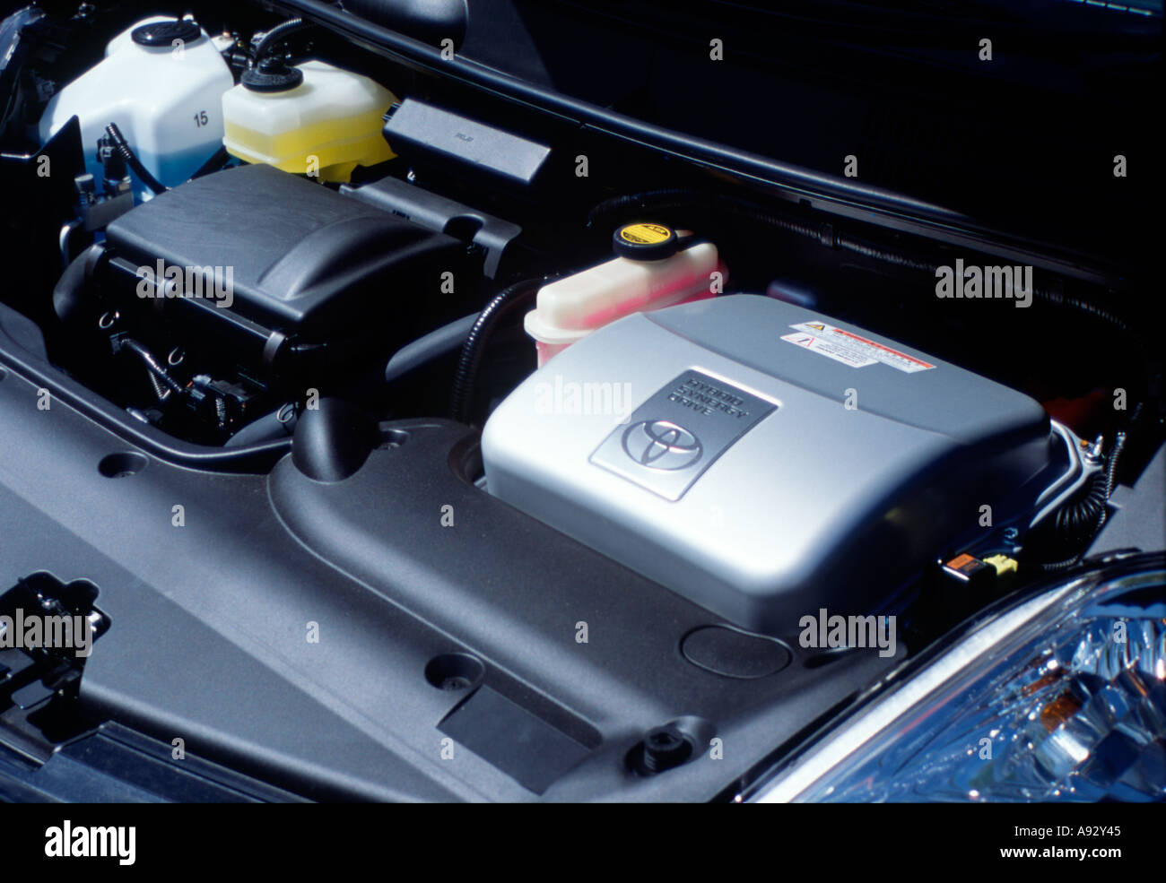 Detail of Toyota Prius hybrid engine technology under bonnet hood Stock Photo