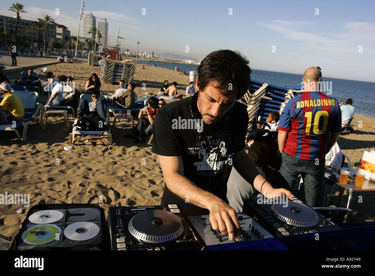 Dj playing music at beach Barcelona Spain Stock Photo