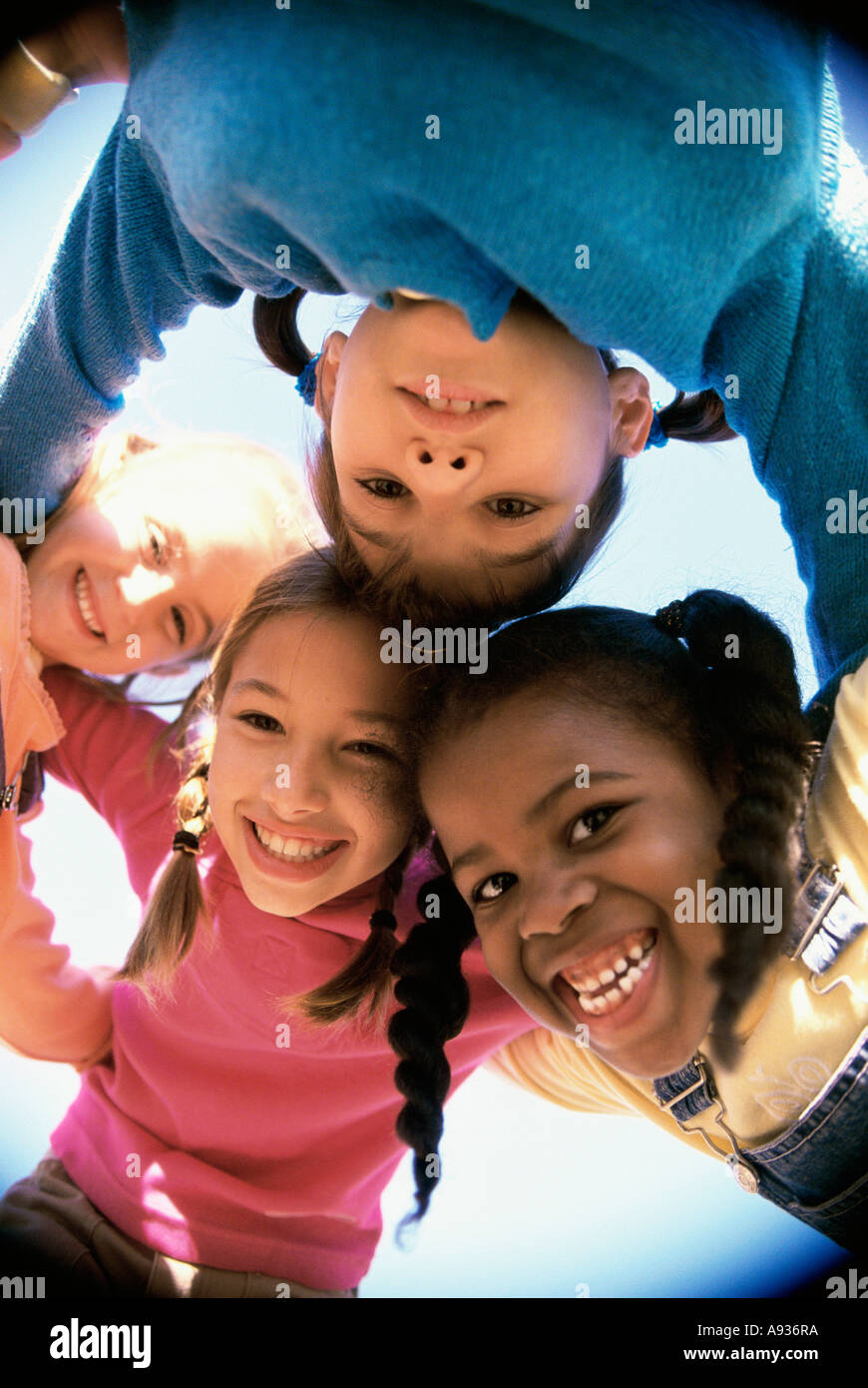 Portrait of a group of children in a huddle Stock Photo - Alamy
