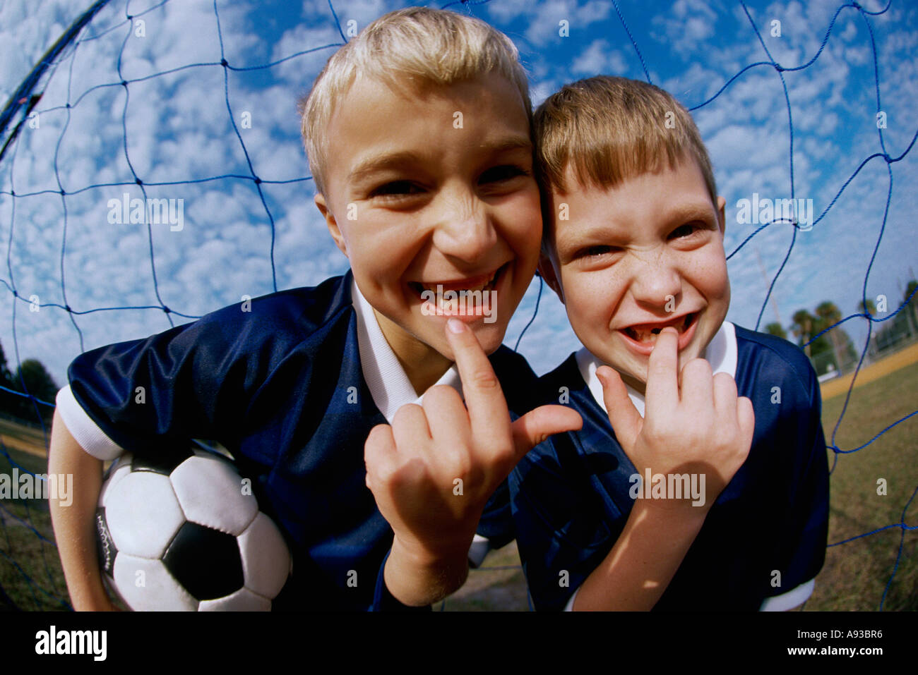 Portrait of two boys showing their missing teeth Stock Photo