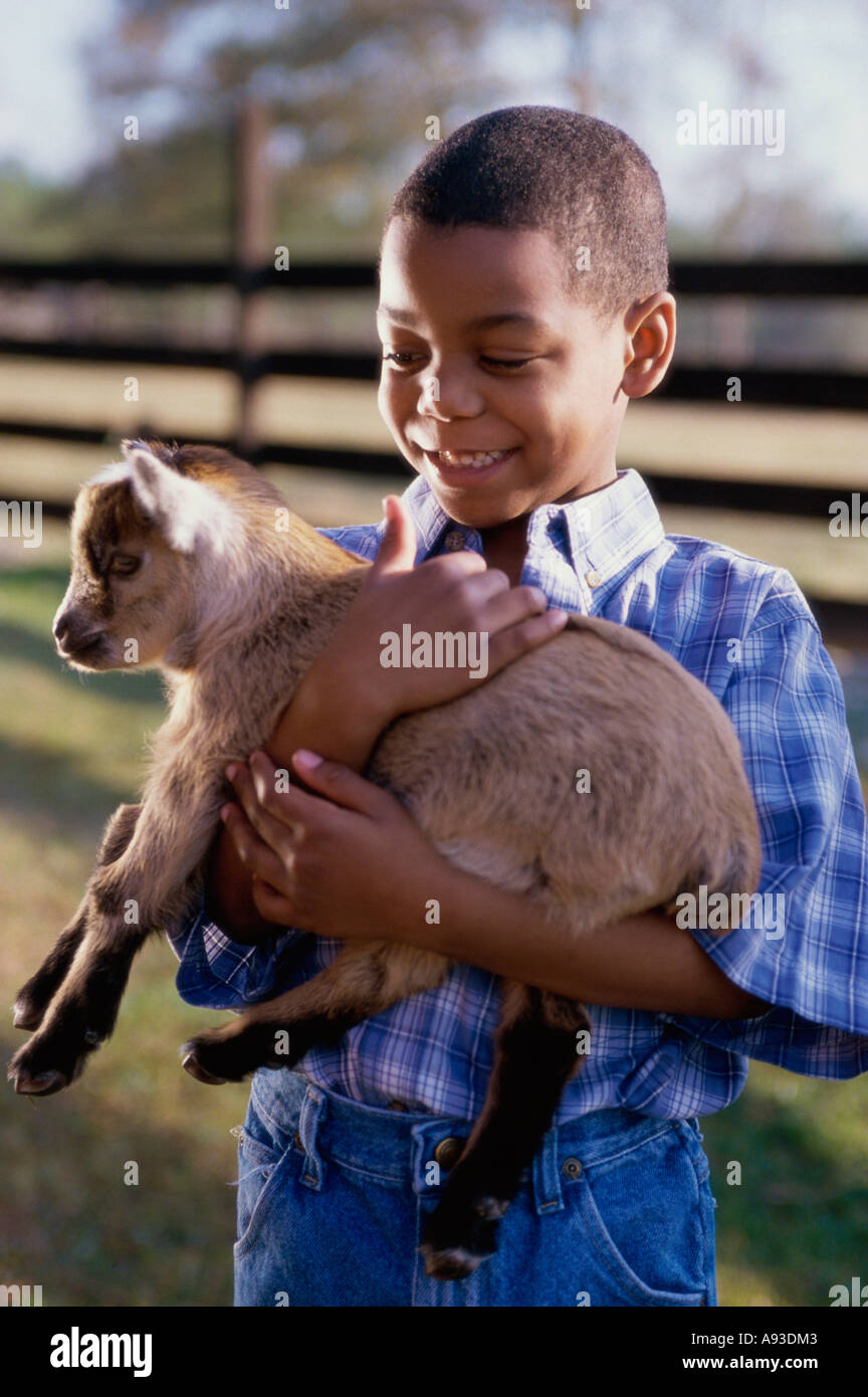 Holding a lamb hi-res stock photography and images - Alamy