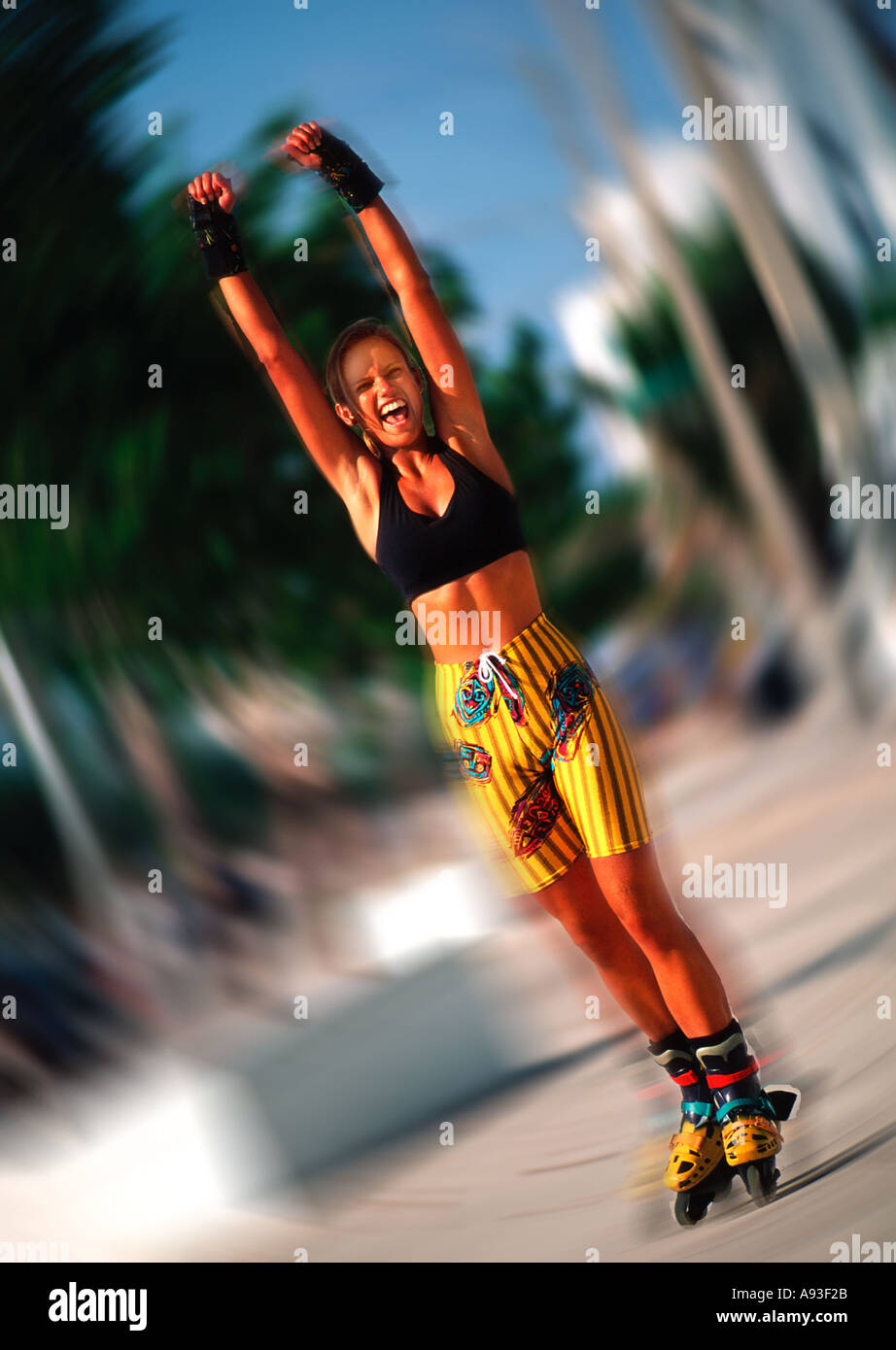 Attractive young woman rollerblading outdoors Stock Photo