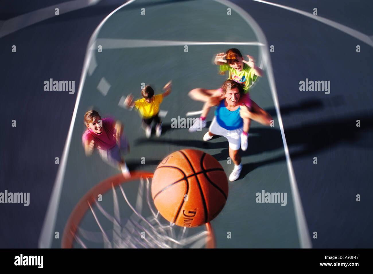 Graphic family playing basketball Stock Photo - Alamy