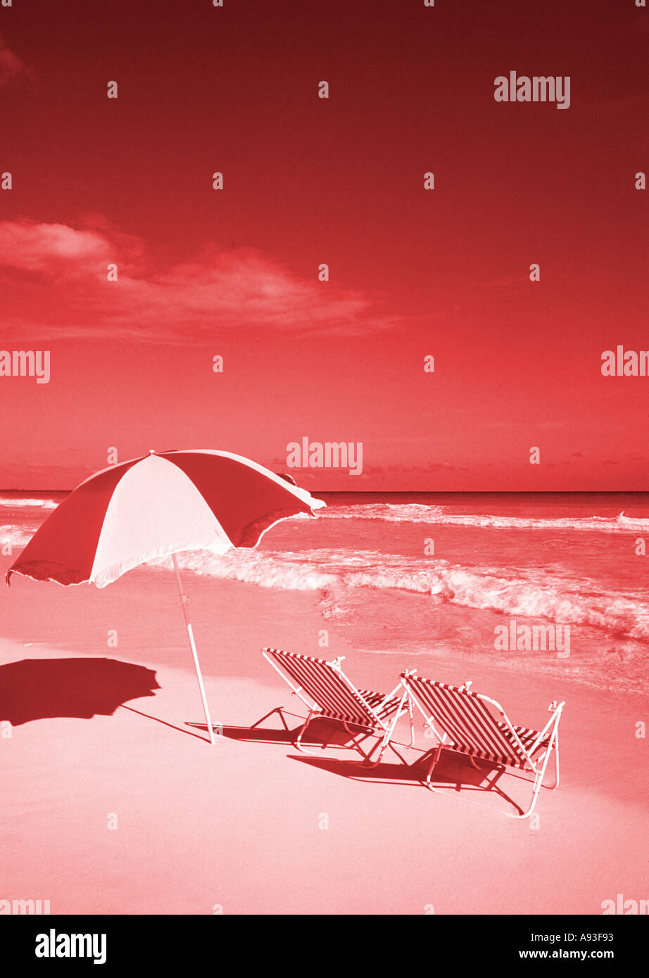 Graphic Lounge chairs and umbrella on the beach Stock Photo Alamy