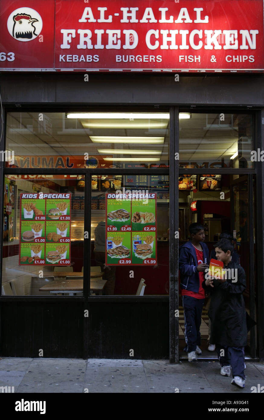Asian Boys Going Out From Al Halal Fried Chicken Shop Brick Lane