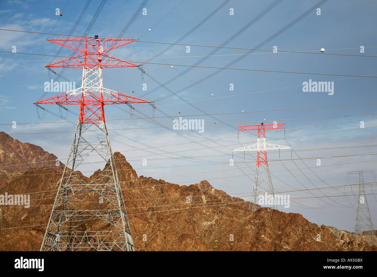 Electricity pylons in mountain landscape Stock Photo - Alamy