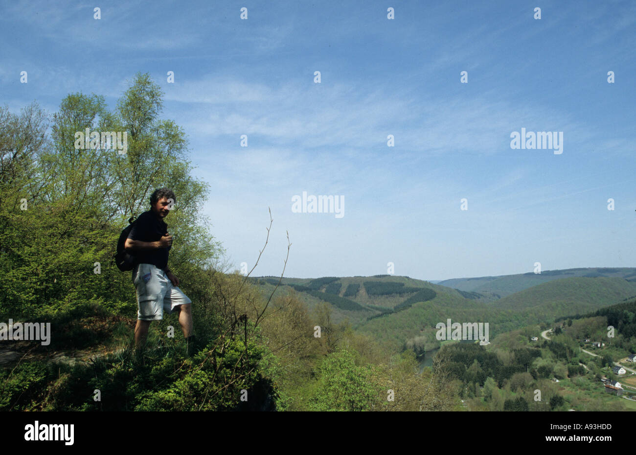 Walker in the Belgian Ardennes overlooking Poupehan village on the Semois river Belgium Stock Photo