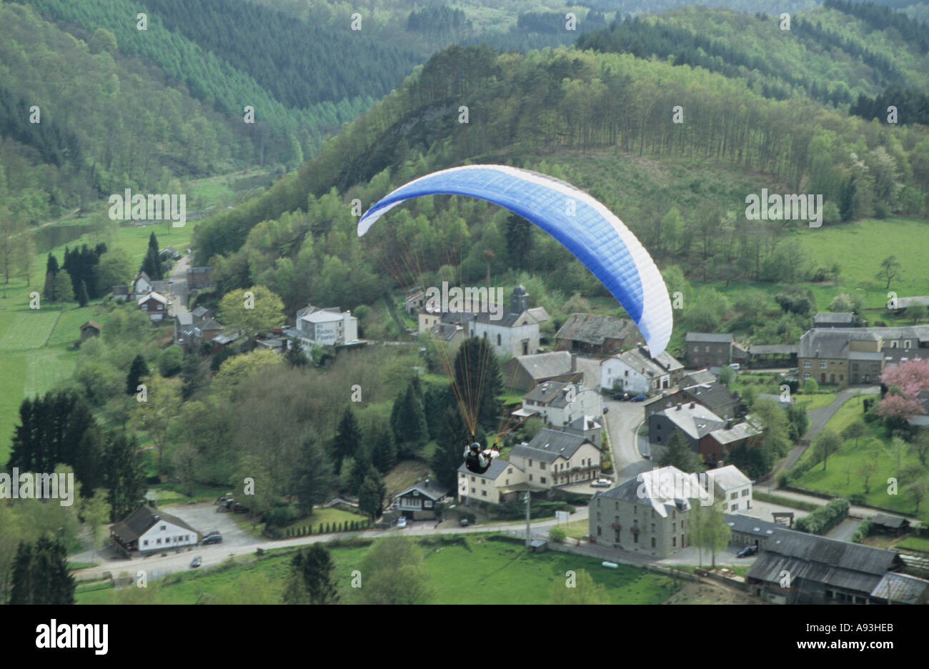 Parascending over the village of Frahan in the Belgian Ardennes Belgium Stock Photo