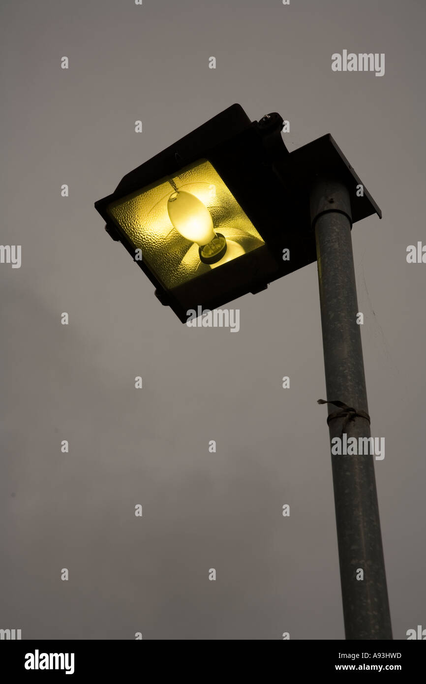 Sodium bulb in security street light showing shape of bulb and reflector Wales UK Stock Photo