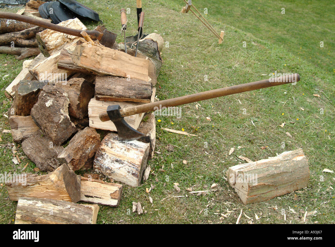 Axe and Pile of wood Stock Photo