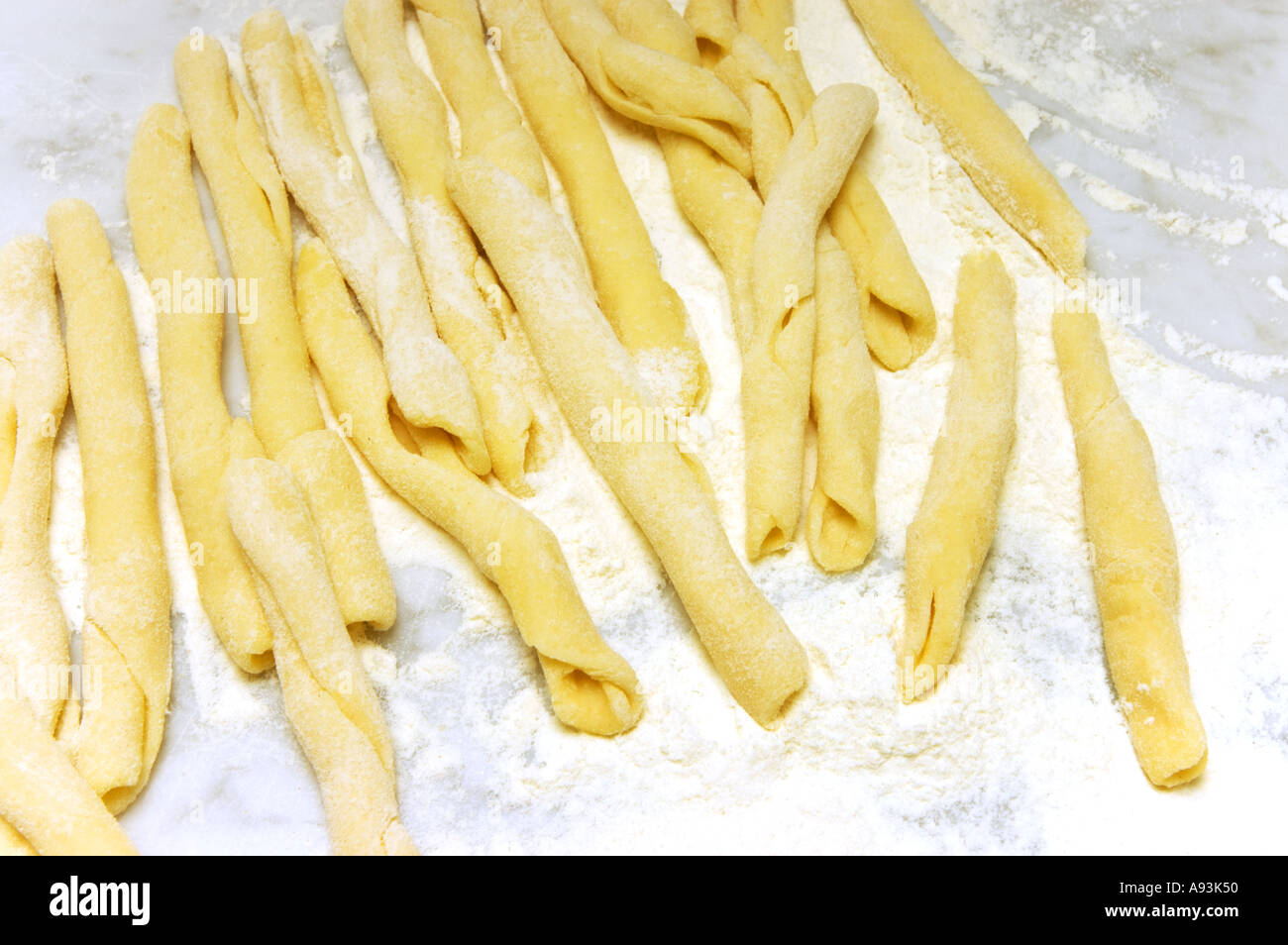 hand made Maccheroni siciliana PASTA speciality special on a white marble plate Stock Photo