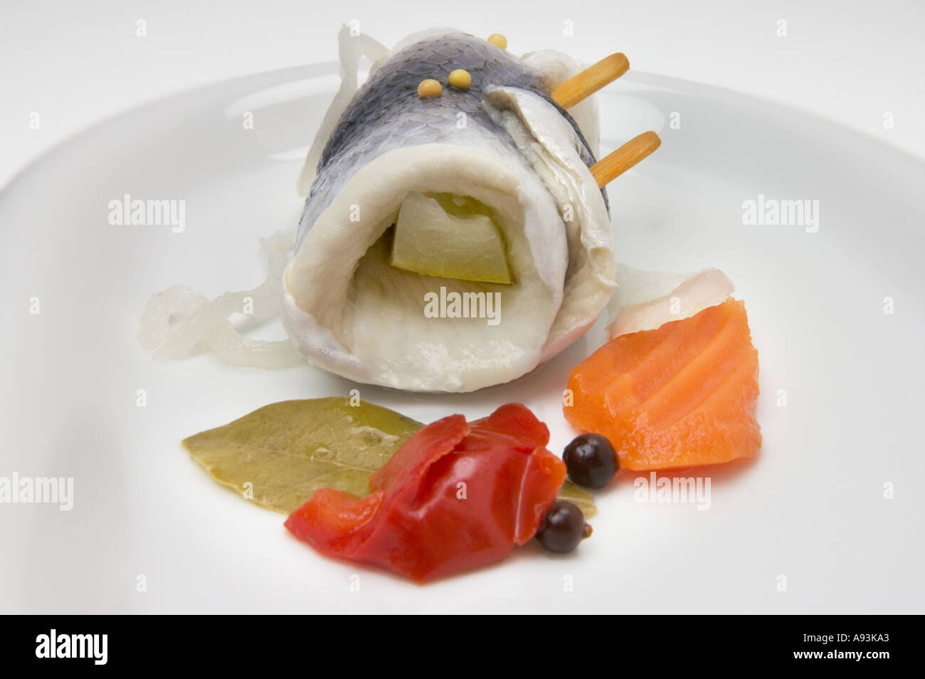 ROLLMOPS ROLLMOP on a white plate roll mops mop Stock Photo