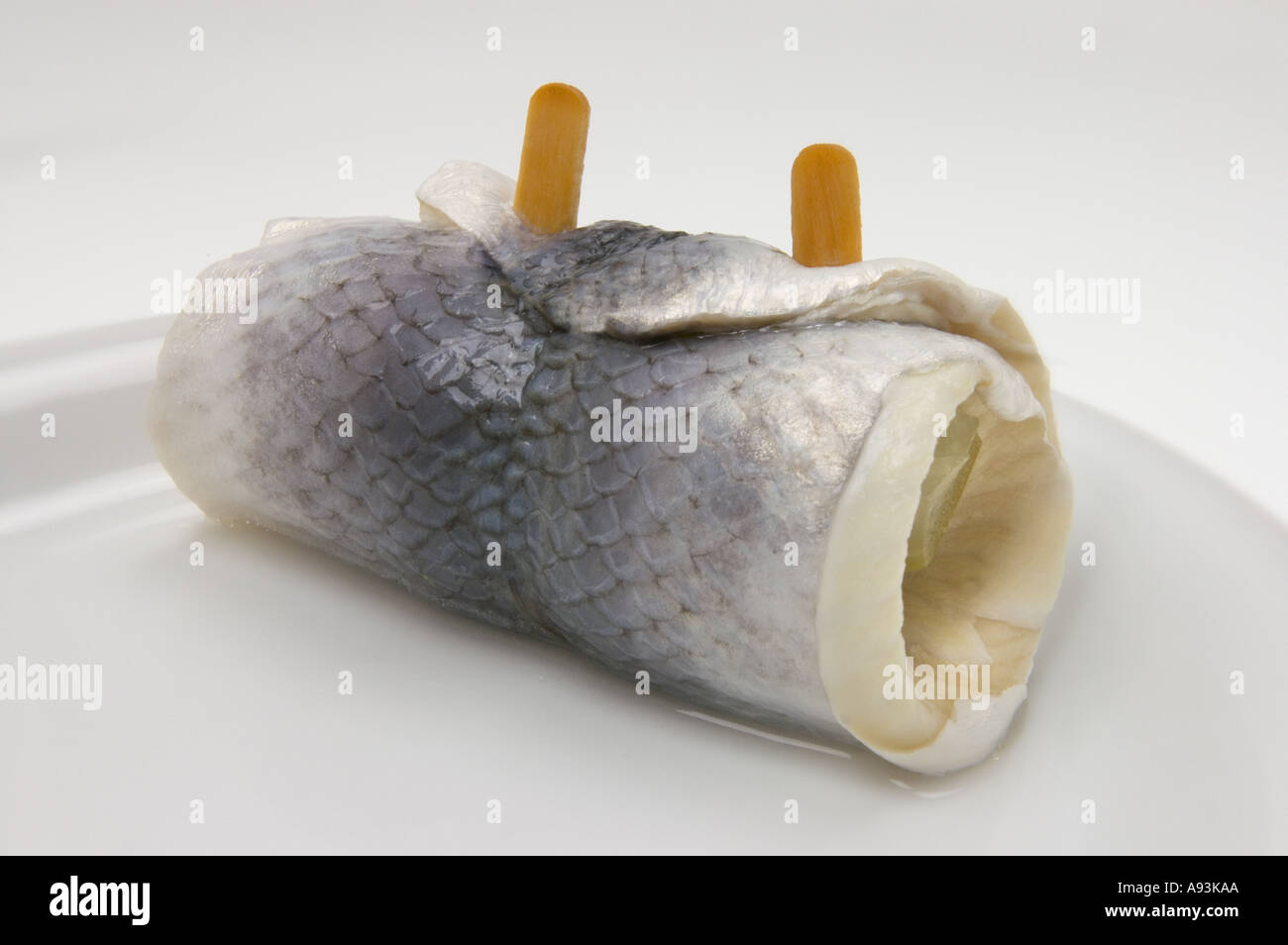 ROLLMOPS ROLLMOP on a white plate roll mops mop Stock Photo