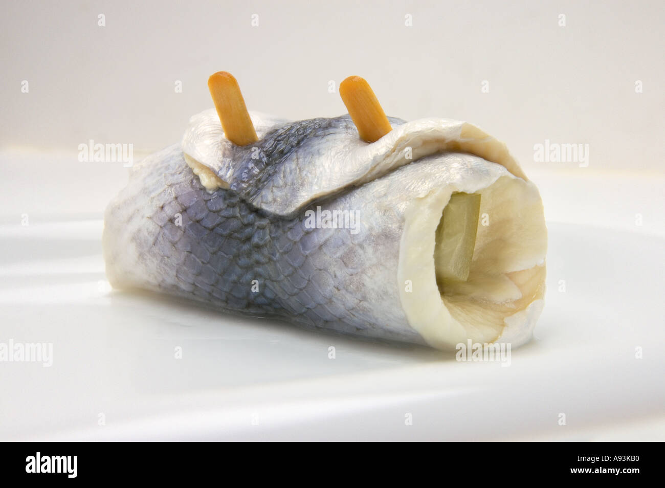 ROLLMOPS ROLLMOP on a white plate roll mops mop Stock Photo