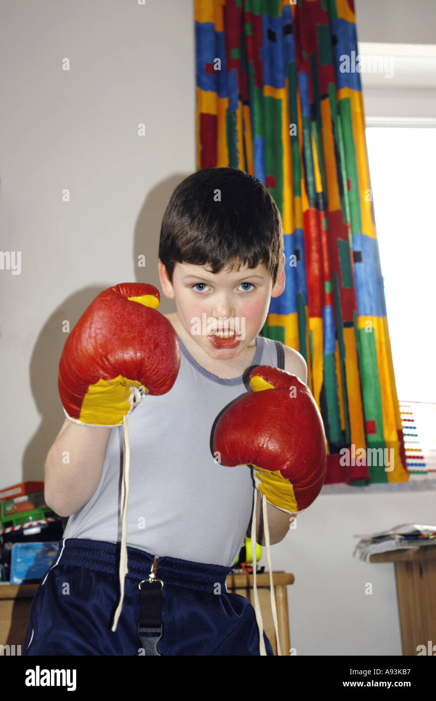 young boy with red Boxing gloves 7 years old Stock Photo Alamy