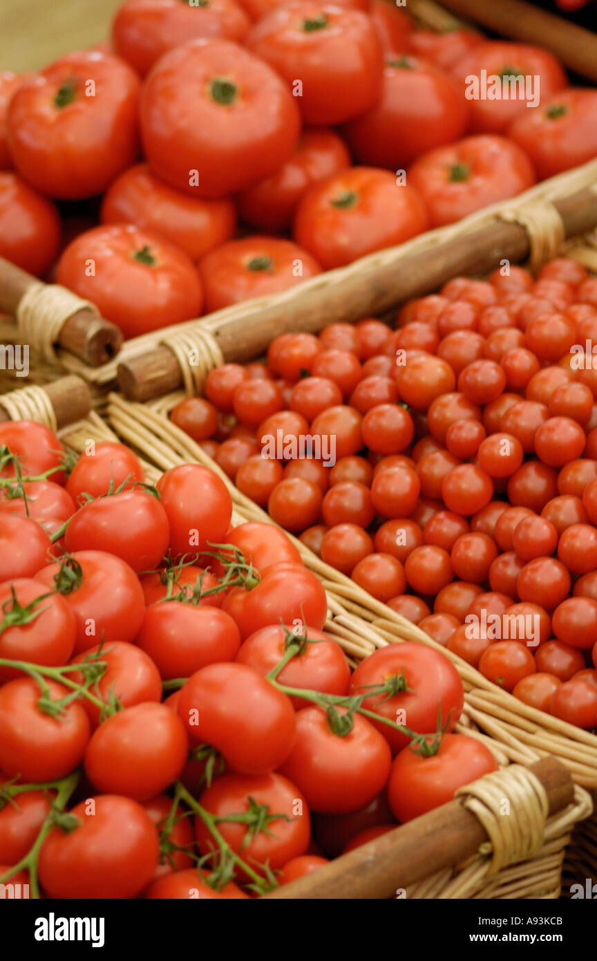 Tomatos in a wicker basket Stock Photo - Alamy