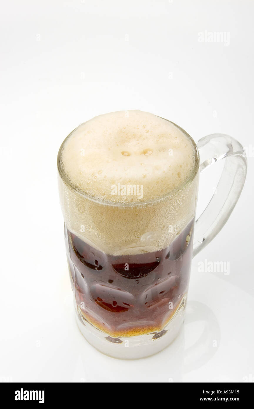 dark beer brown bier STOUT in a pitcher jug made of glass Stock Photo