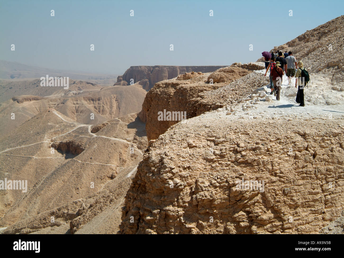 Group walking between the Valley of the Kings and the Valley of the Queens, Luxor, Egypt Stock Photo