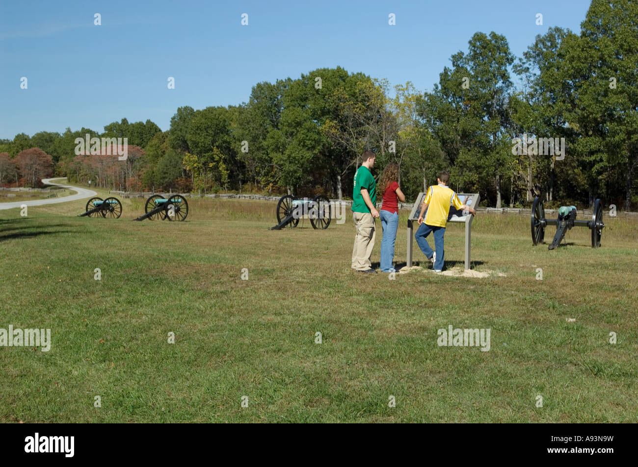 Family looking at a sign at the Pea Ridge National Military Park AR