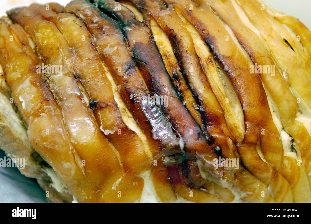 Roast pork joint with crackling cooked and ready for carving Stock