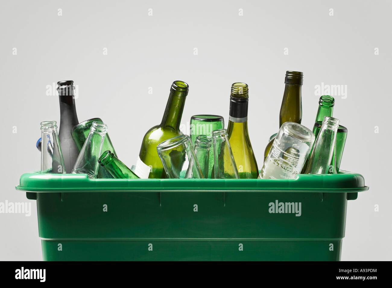 Empty bottles in green container Stock Photo