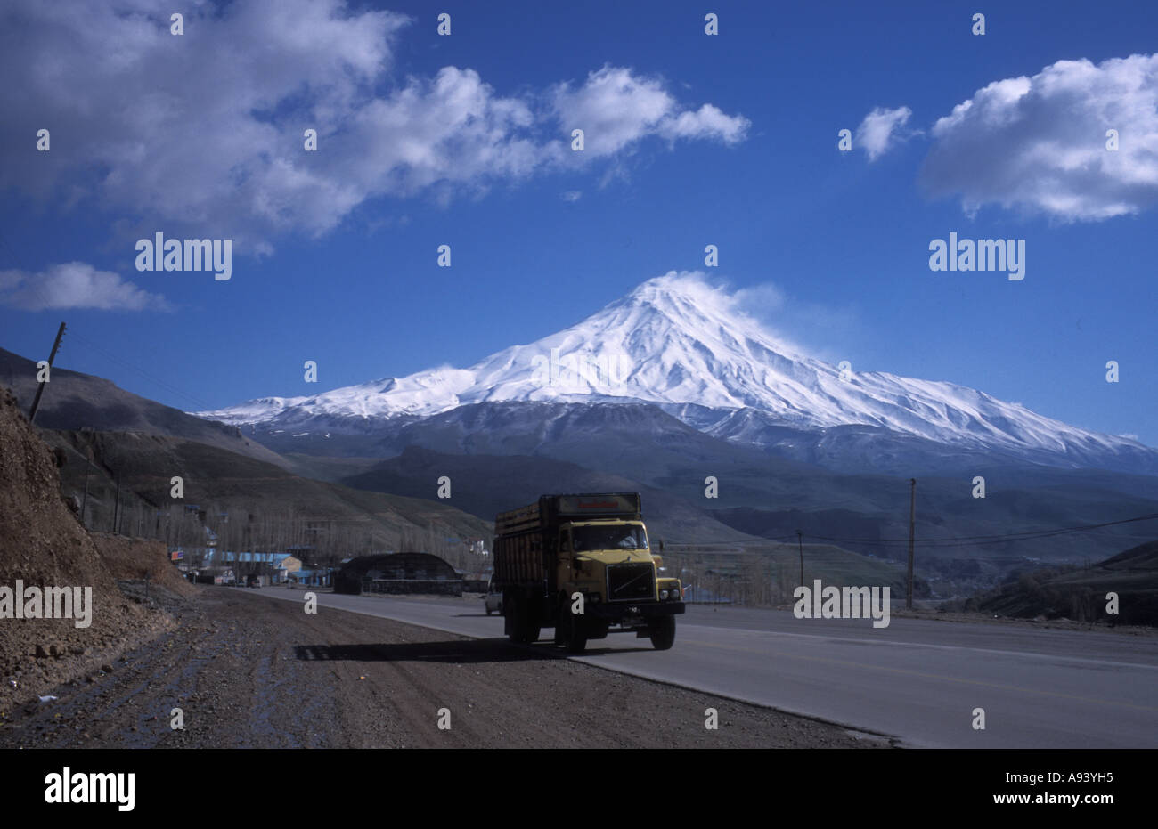 Road with Mount Damavand in background , Iran Stock Photo