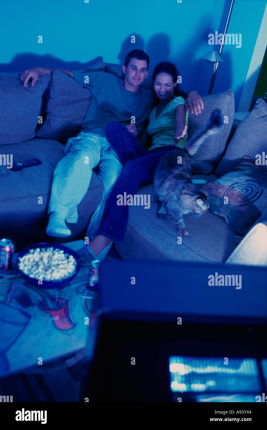 High angle view of a young couple watching television Stock Photo