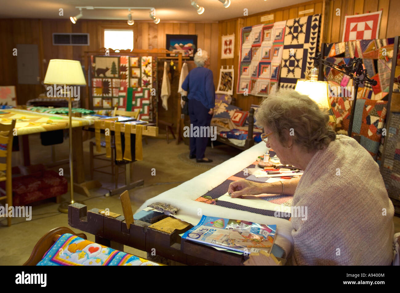 Quilter making quilt in the Crafts Village at the Ozark Folk Center