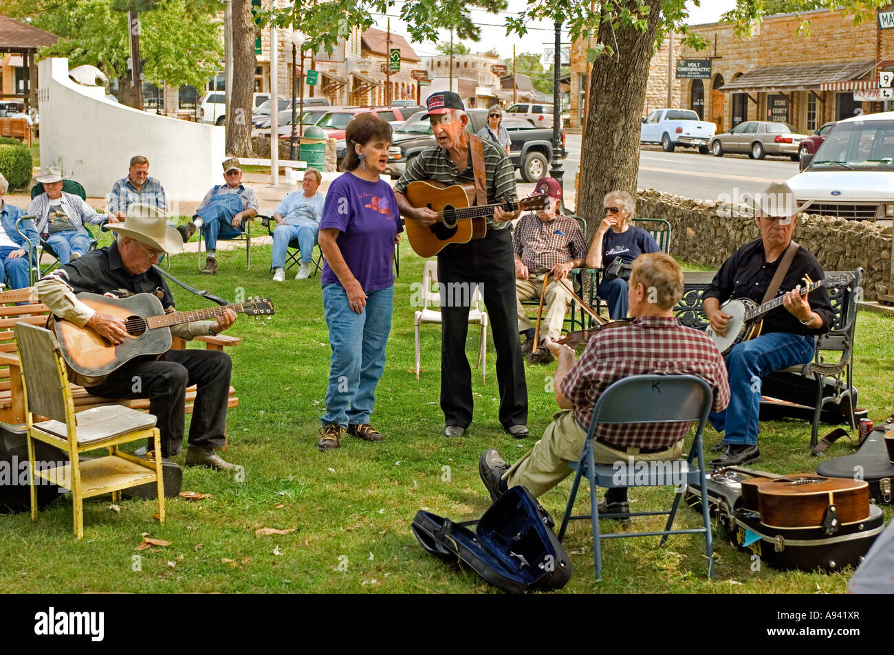Folk musicians performing in the downtown square on Saturday afternoon Mountain View AR Stock Photo
