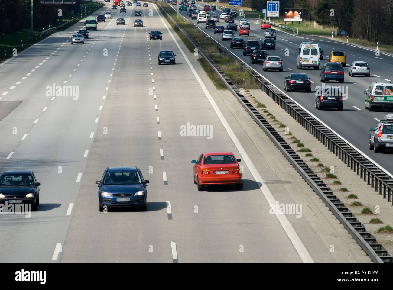 Geisterfahrer driver in red BMW driving wrong direction digital composing Munich Germany Europe Stock Photo