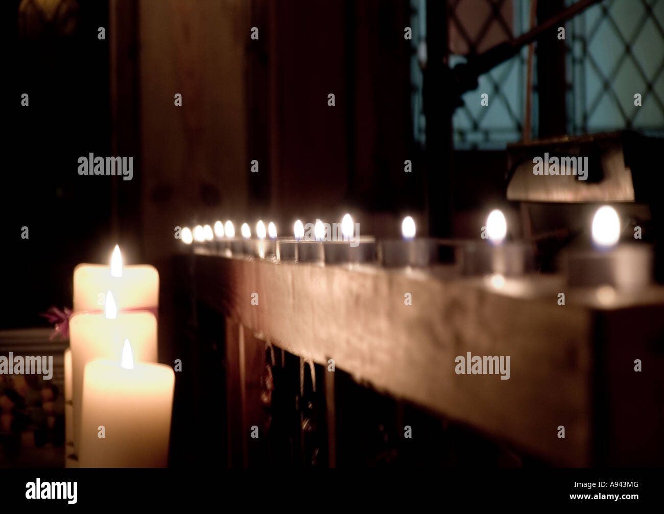 lots of candles in church Stock Photo Alamy