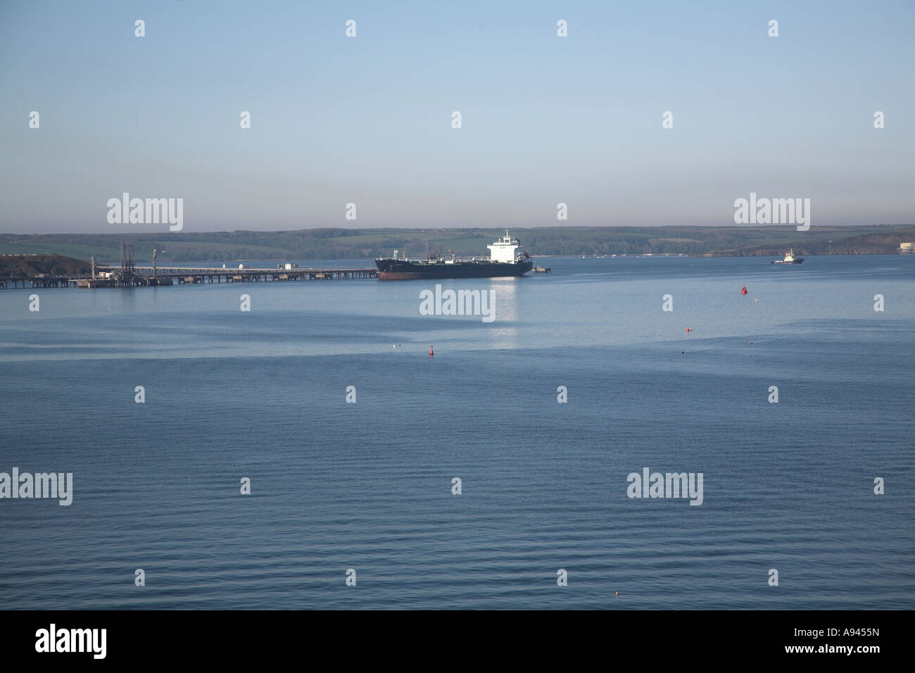 Milford Haven estuary oil terminals and ships, Pembrokeshire, Wales Stock Photo