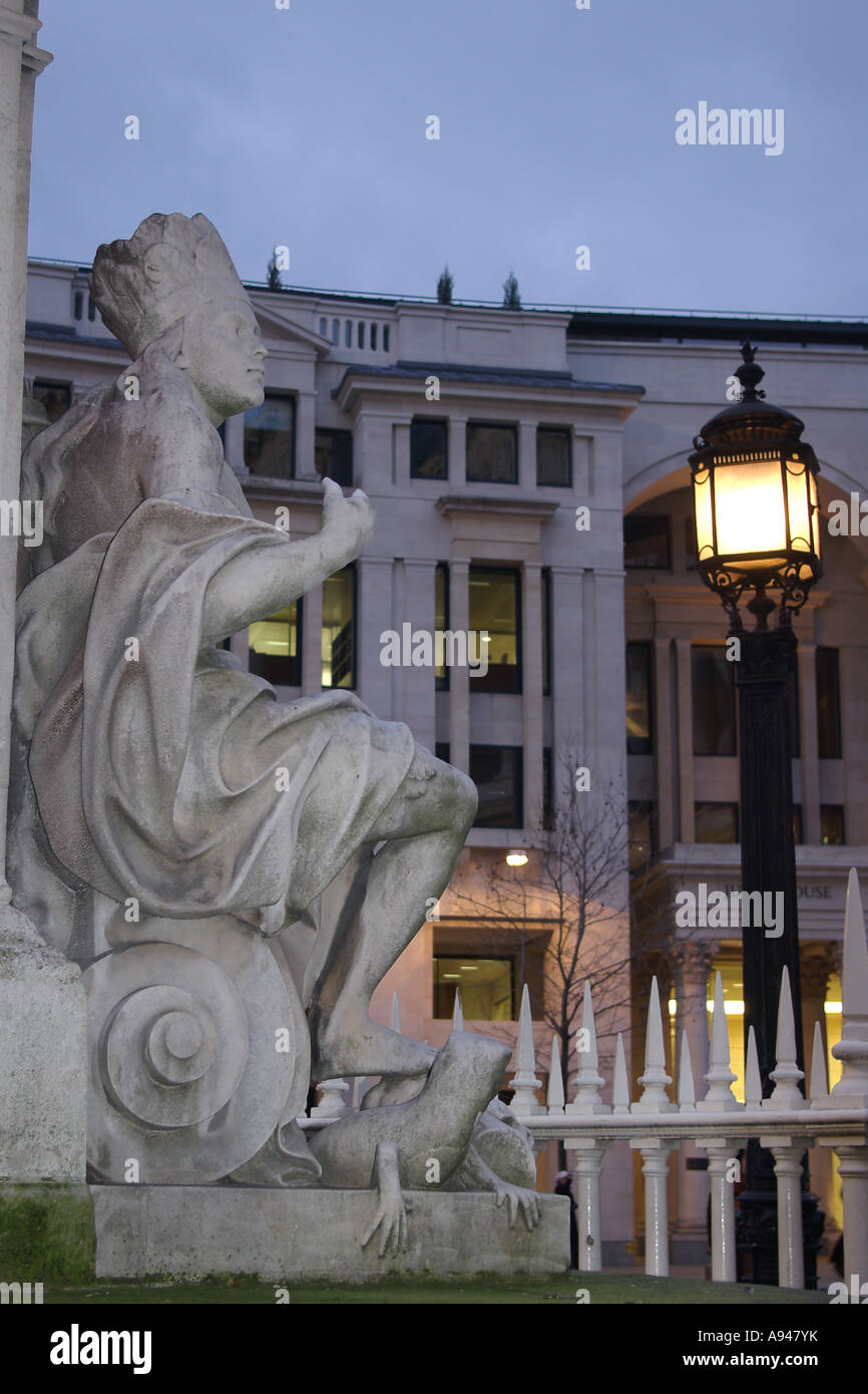 Statue over looking St Pauls Catheadral keeping a watchfull eye by one dreary oncoming night Stock Photo