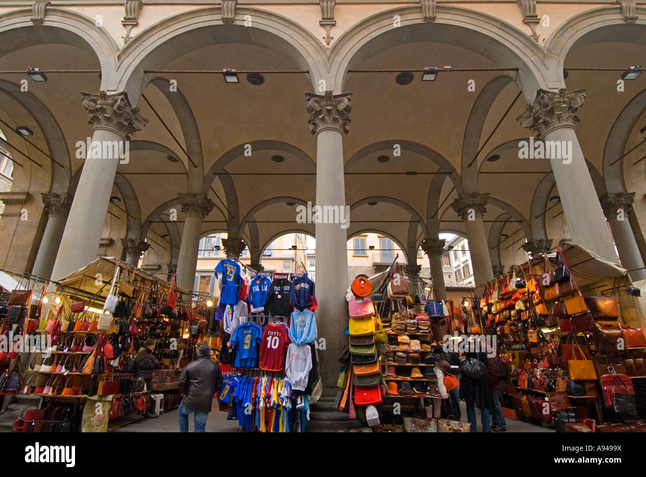 Horizontal angular view of the many stalls of Italian leather goods set up at the Mercato Nuovo 'New market'. Stock Photo