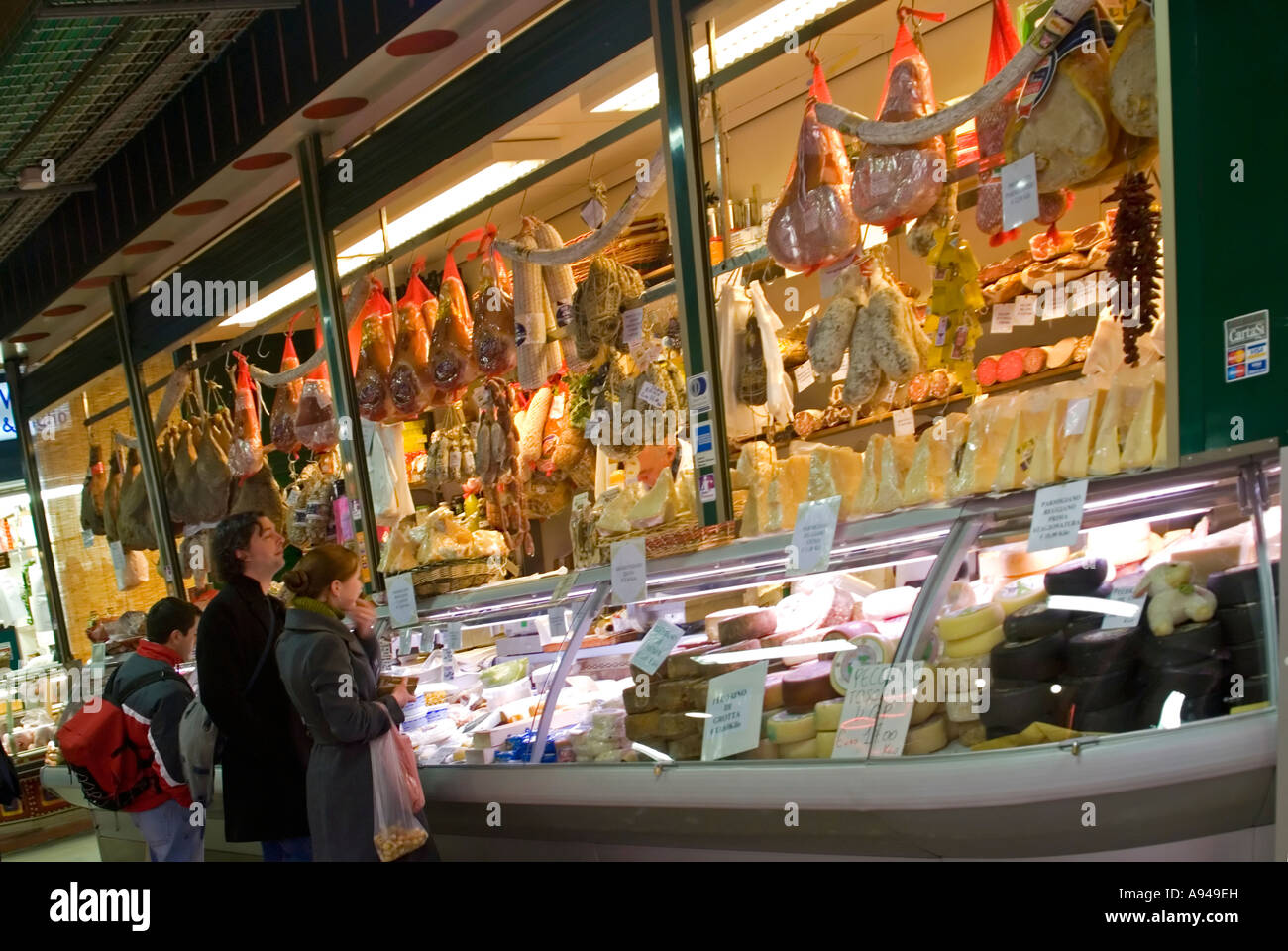 Horizontal close up of customers at a traditional Italian delicatessen