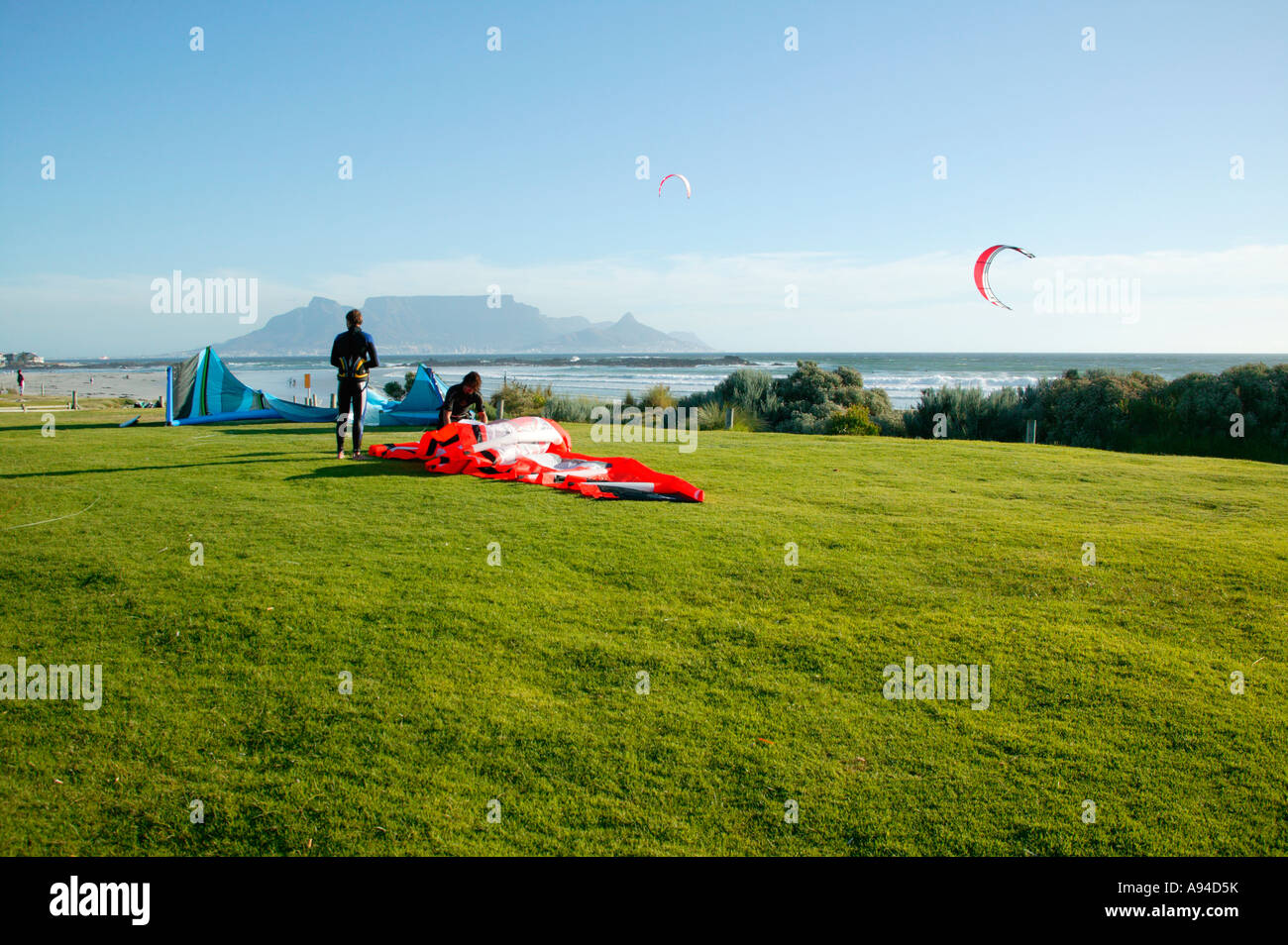 Kite surfers at one of Cape Towns beaches with Table Mountain in the